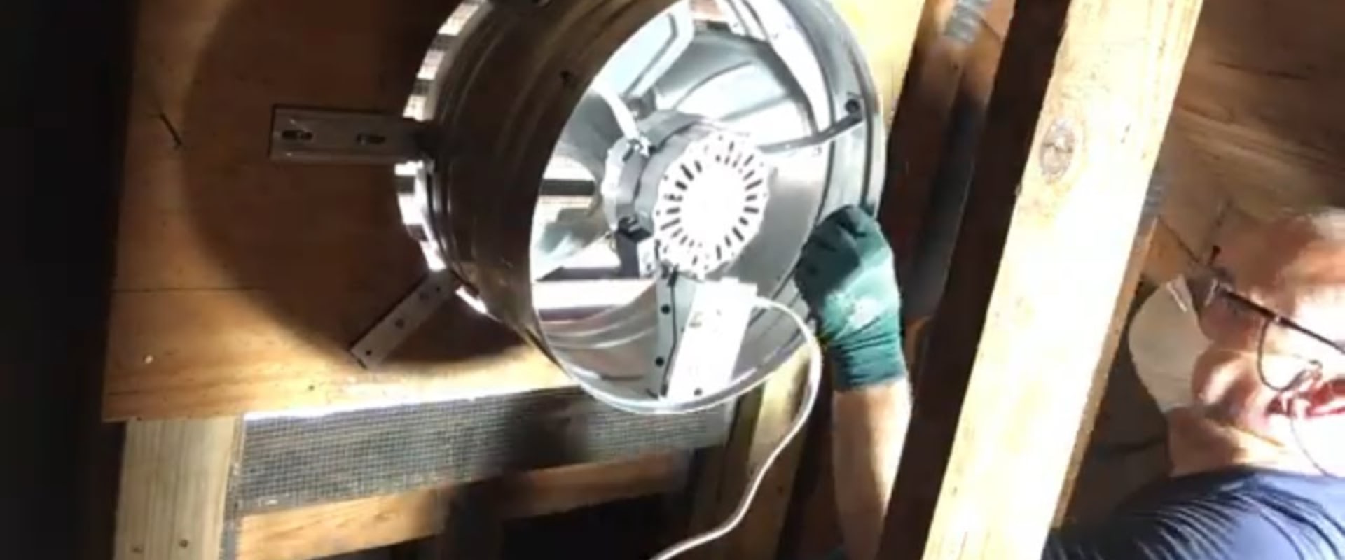 What professional installs attic fans?